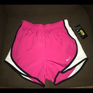 pink NIKE women’s running shorts